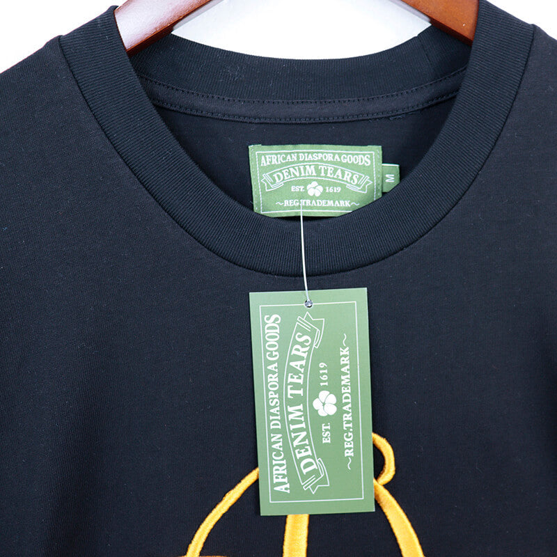 Denim Tears Metallic Gold Script Tee DENIM TEARS
